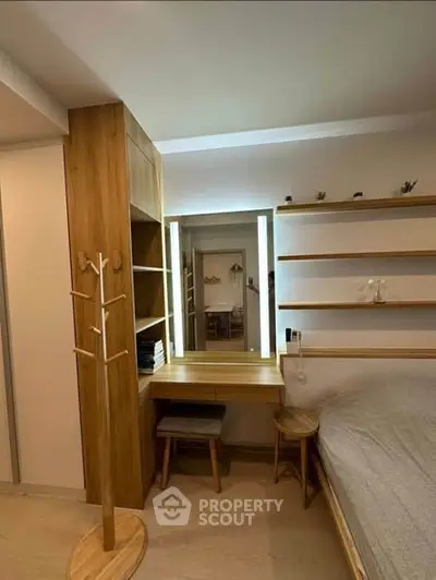 Cozy bedroom with wooden furniture and built-in vanity mirror