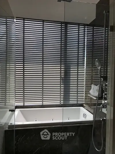 Luxurious bathroom with modern bathtub and sleek shower design