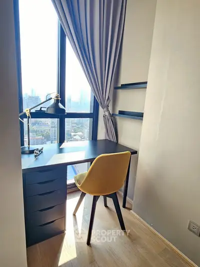 Bright study room with city view, featuring a sleek desk and modern chair, perfect for productivity.