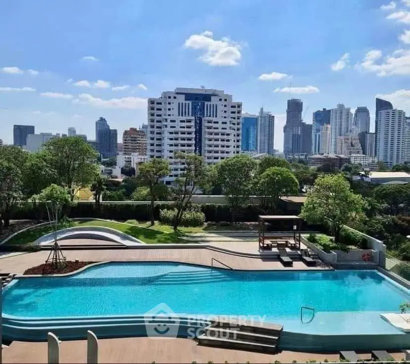 Luxurious rooftop pool with stunning city skyline view, perfect for relaxation and leisure in urban living.