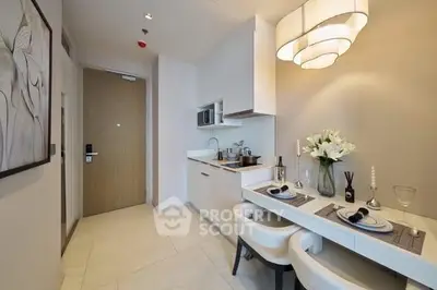 Modern compact kitchen with dining area in a stylish apartment