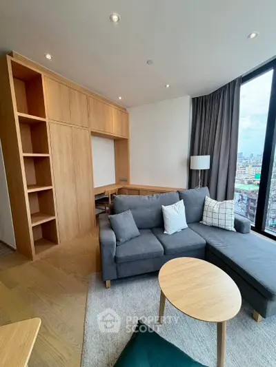 Modern living room with large windows and stylish wooden furniture