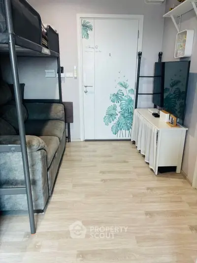Cozy compact living room with loft bed and modern decor