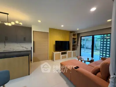 Modern living room with stylish decor and large window view