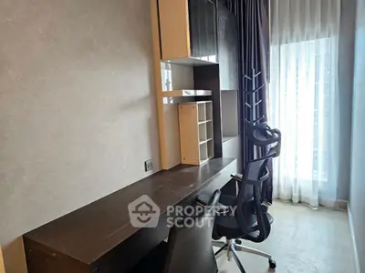 Modern study room with sleek desk and ergonomic chairs, featuring floor-to-ceiling window for natural light.