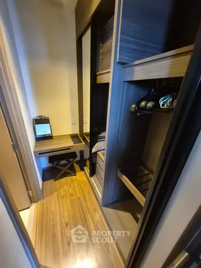 Spacious walk-in closet with modern wooden shelving and ample storage space.