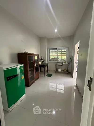 Spacious kitchen with modern appliances and ample natural light