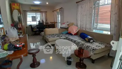 Spacious living room with modern decor and ample natural light