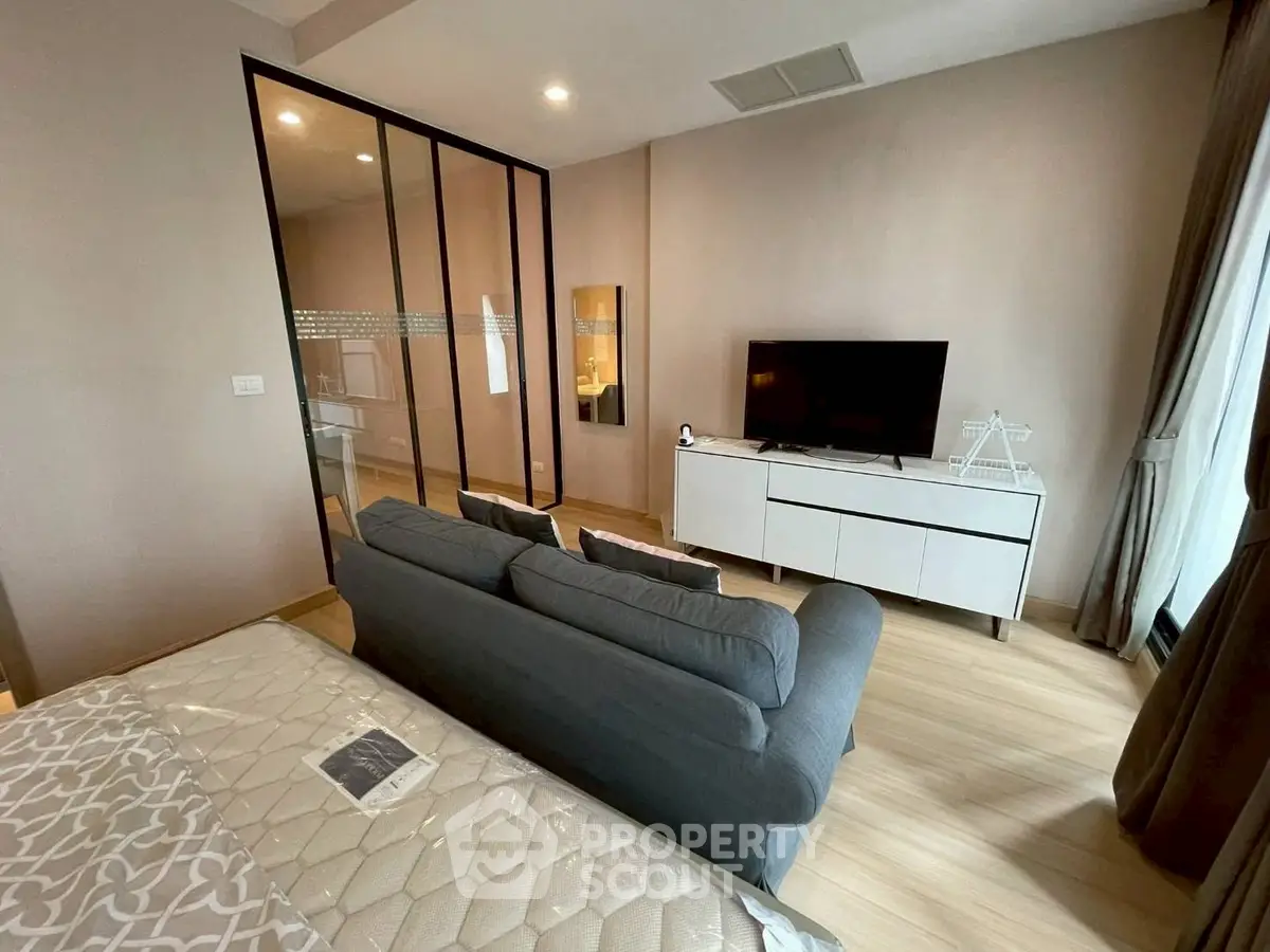 Modern studio apartment with cozy living area and stylish decor