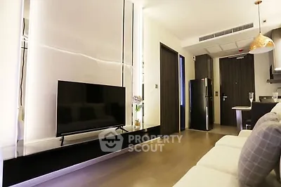 Modern living room with sleek TV setup and stylish lighting