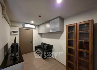 Modern living room with sleek furniture and ample storage space