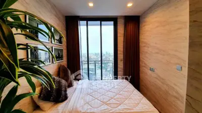 Luxurious bedroom with stunning city view and elegant decor