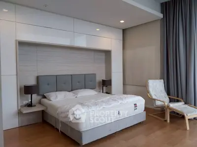 Modern bedroom with stylish decor and comfortable bed in a luxury apartment.