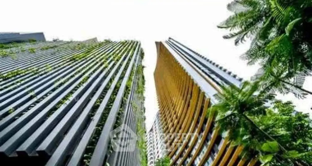 Stunning modern high-rise buildings with lush greenery and unique architectural design.