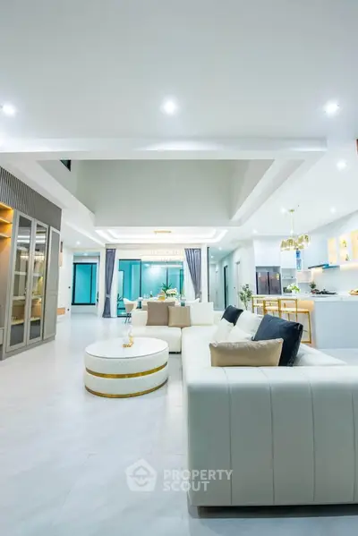 Luxurious open-plan living room with modern decor and spacious layout