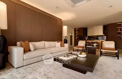 Luxurious modern living room with elegant furniture and open kitchen layout, perfect for sophisticated living.