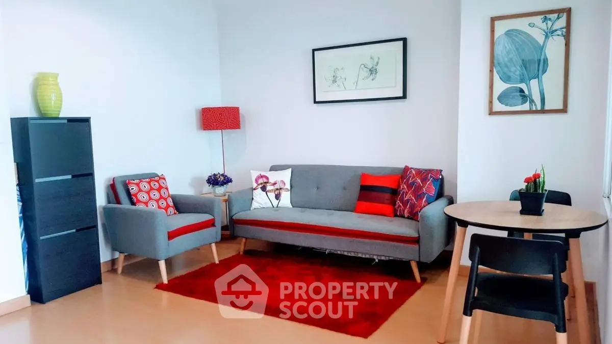 Charming living room with modern decor and vibrant red accents