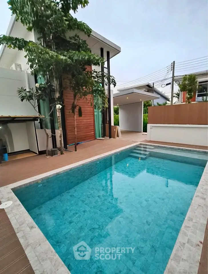 Luxurious modern home with private pool and stylish exterior design.