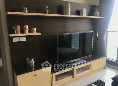 Modern living room with sleek TV unit and decorative shelves