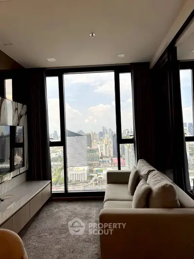 Luxurious living room with stunning city view from floor-to-ceiling windows.