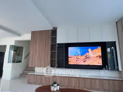 Modern living room with built-in entertainment center and sleek design