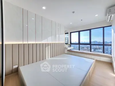 Modern bedroom with panoramic city view and sleek minimalist design