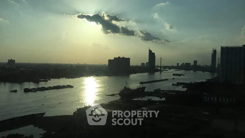 Stunning river view from high-rise building at sunset, perfect for urban living enthusiasts.