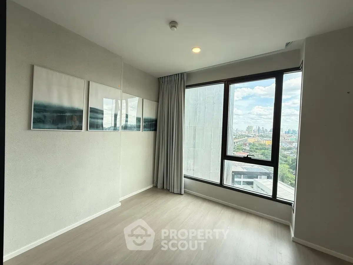 Spacious corner unit with large windows offering a stunning city view, perfect for modern living.