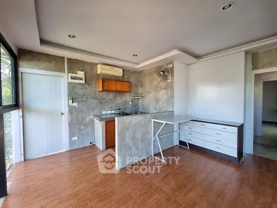 Modern kitchen with open layout and sleek design in a bright apartment