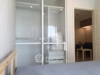 Modern bedroom with sliding closet doors and minimalistic decor