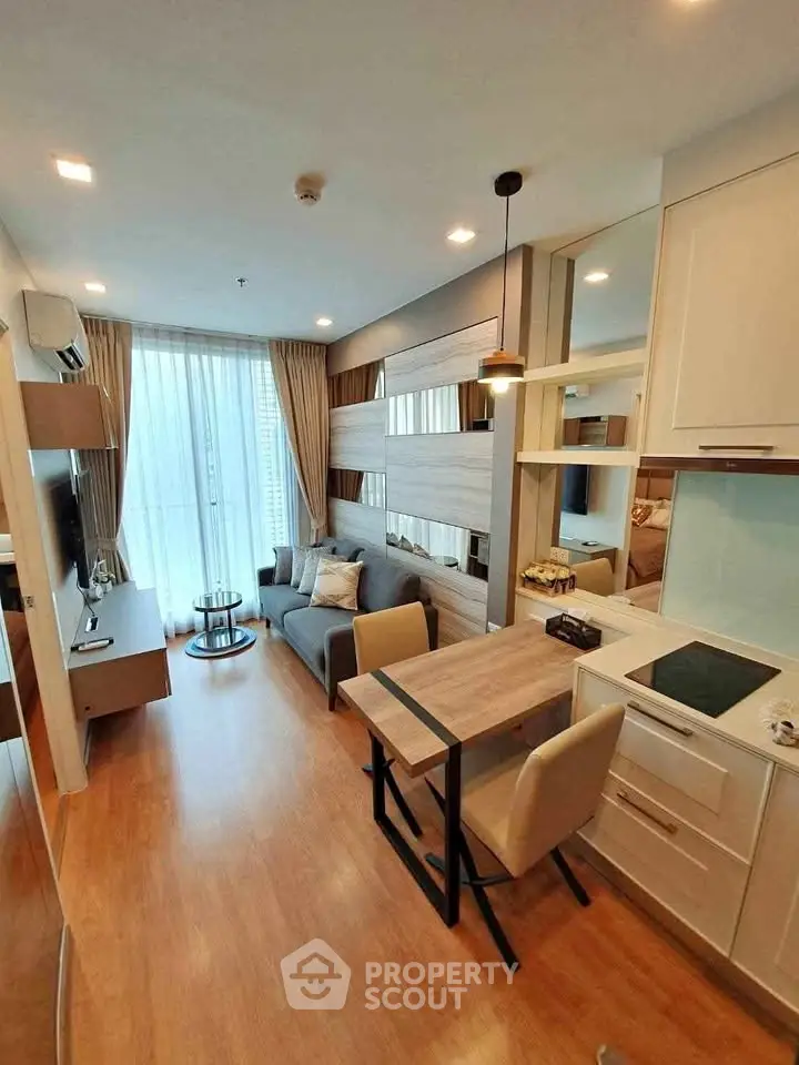 Modern living room with open kitchen in stylish apartment