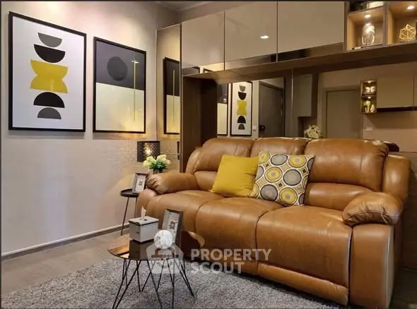 Stylish living room with leather sofa and modern art decor