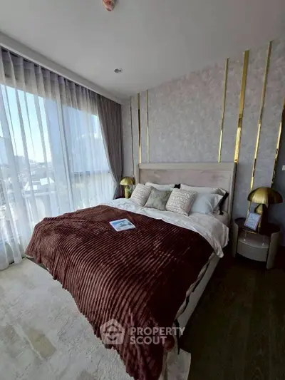 Luxurious bedroom with elegant decor and stunning city view through large windows.