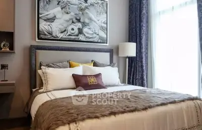 Luxurious bedroom with elegant decor and plush bedding in a modern real estate property.