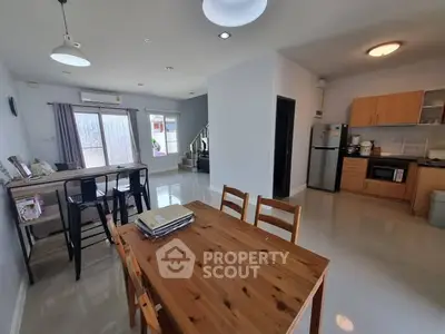 Spacious open-plan kitchen and dining area with modern appliances and natural light.