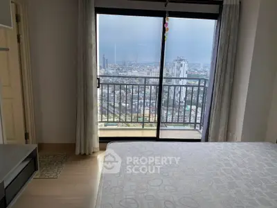 High-rise bedroom with stunning city view from balcony, modern decor and ample natural light.