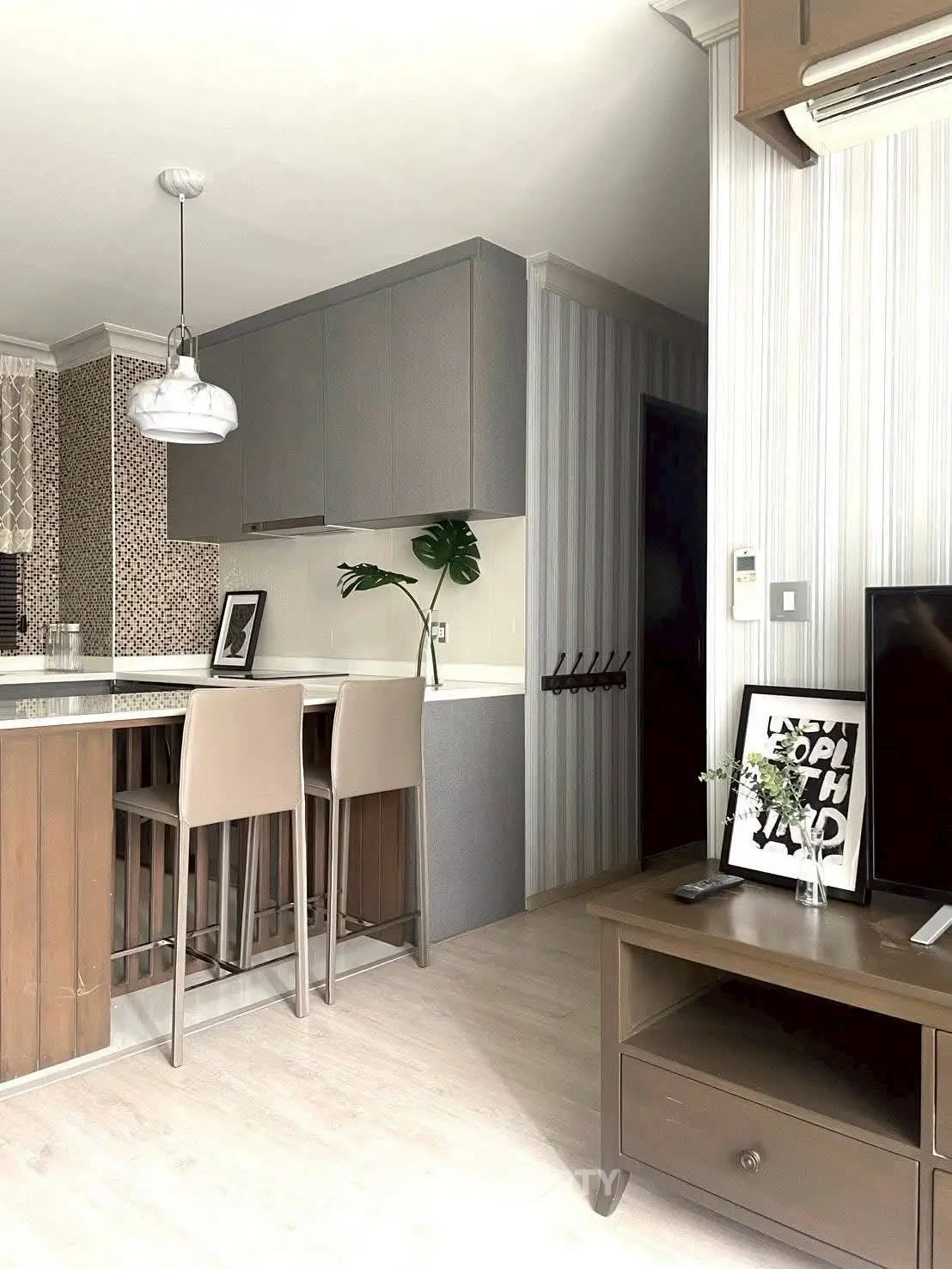 Modern kitchen with open layout and stylish decor in a contemporary apartment.