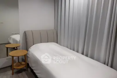 Cozy minimalist bedroom with single bed and stylish side table