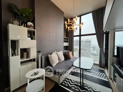 Modern living room with large windows and city view, stylish decor and cozy seating area.