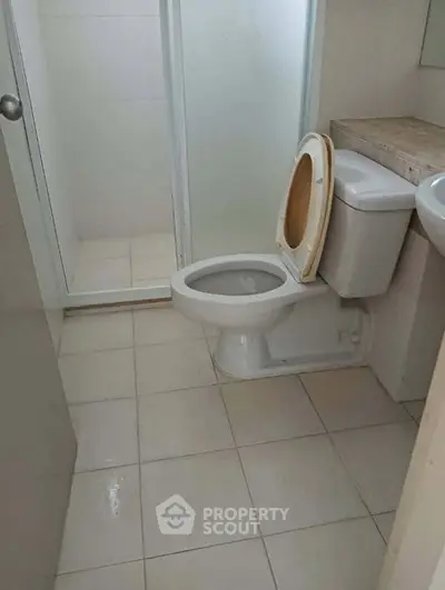 Compact bathroom with shower and toilet in modern apartment