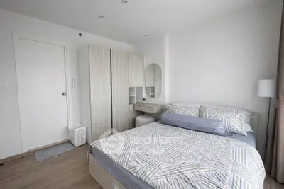Modern bedroom with stylish decor and ample storage space