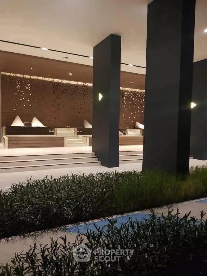 Luxurious modern building entrance with elegant design and ambient lighting