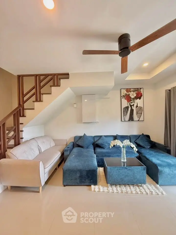 Stylish living room with modern furniture and elegant decor in a cozy home setting.