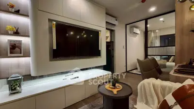 Modern living room with sleek design, featuring a large TV, stylish furniture, and ambient lighting.