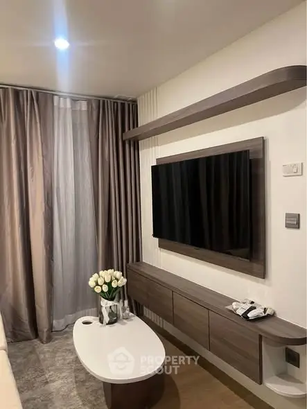 Modern living room with sleek TV setup and elegant decor