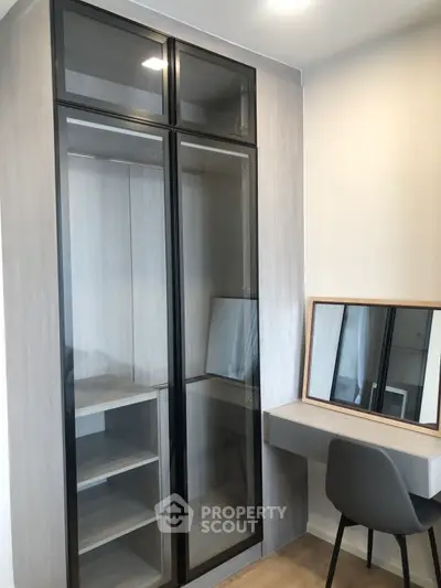 Modern bedroom with sleek wardrobe and stylish vanity desk