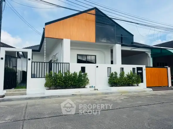 Modern single-story house with sleek design and wooden accents