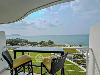 Stunning ocean view from modern balcony with stylish seating.
