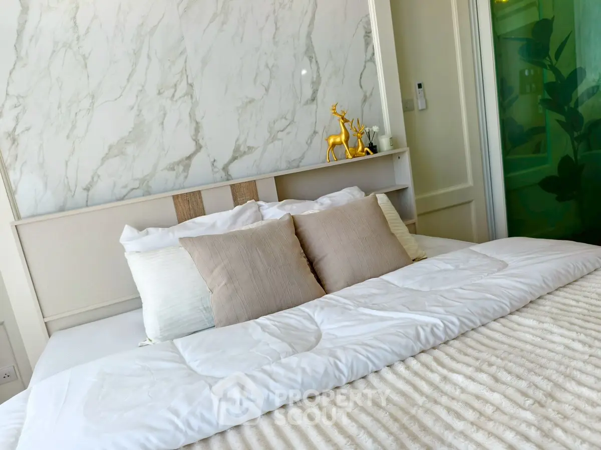 Luxurious bedroom with elegant decor and plush bedding for ultimate comfort.