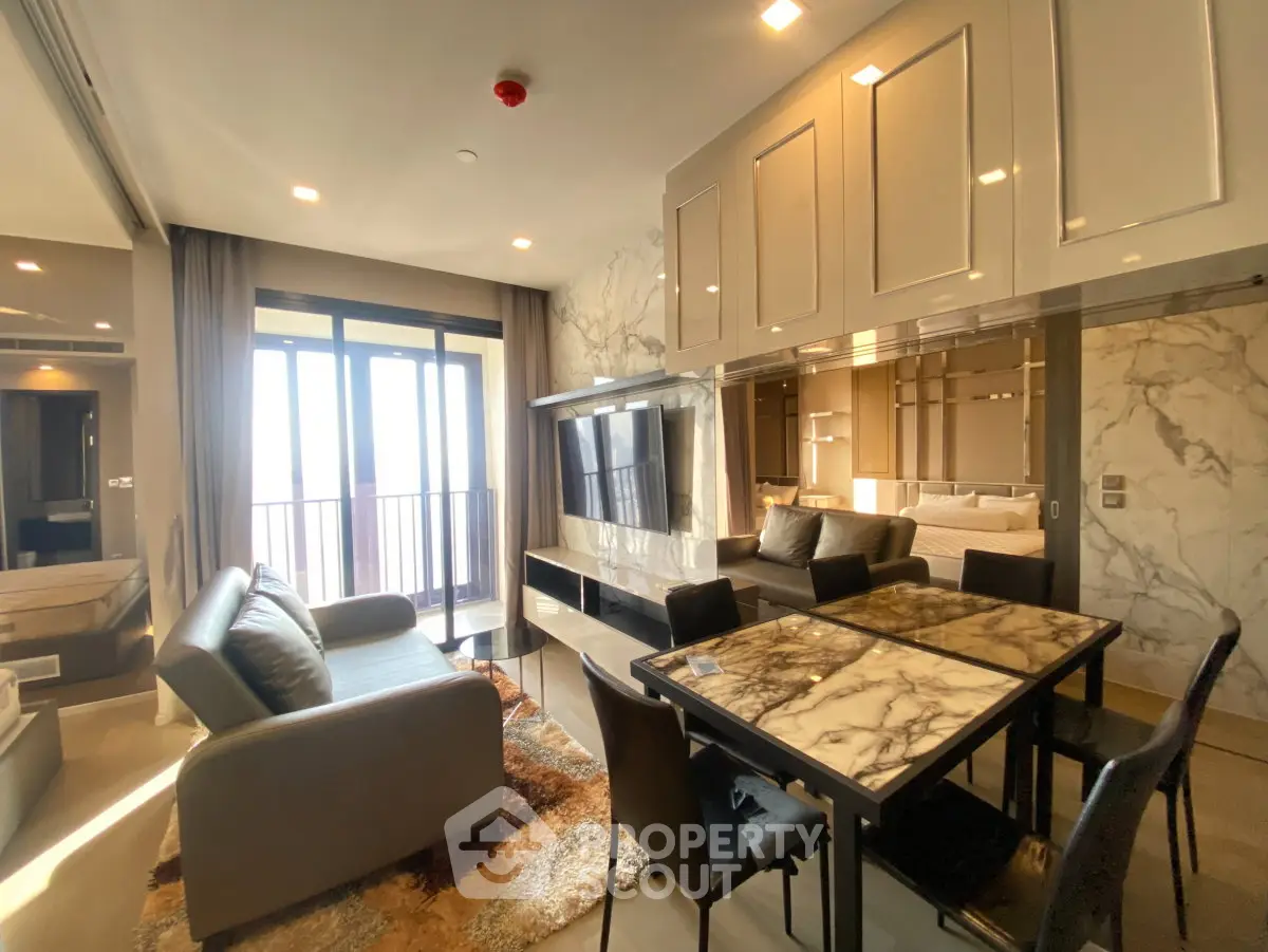 Luxurious modern living room with marble accents and balcony view
